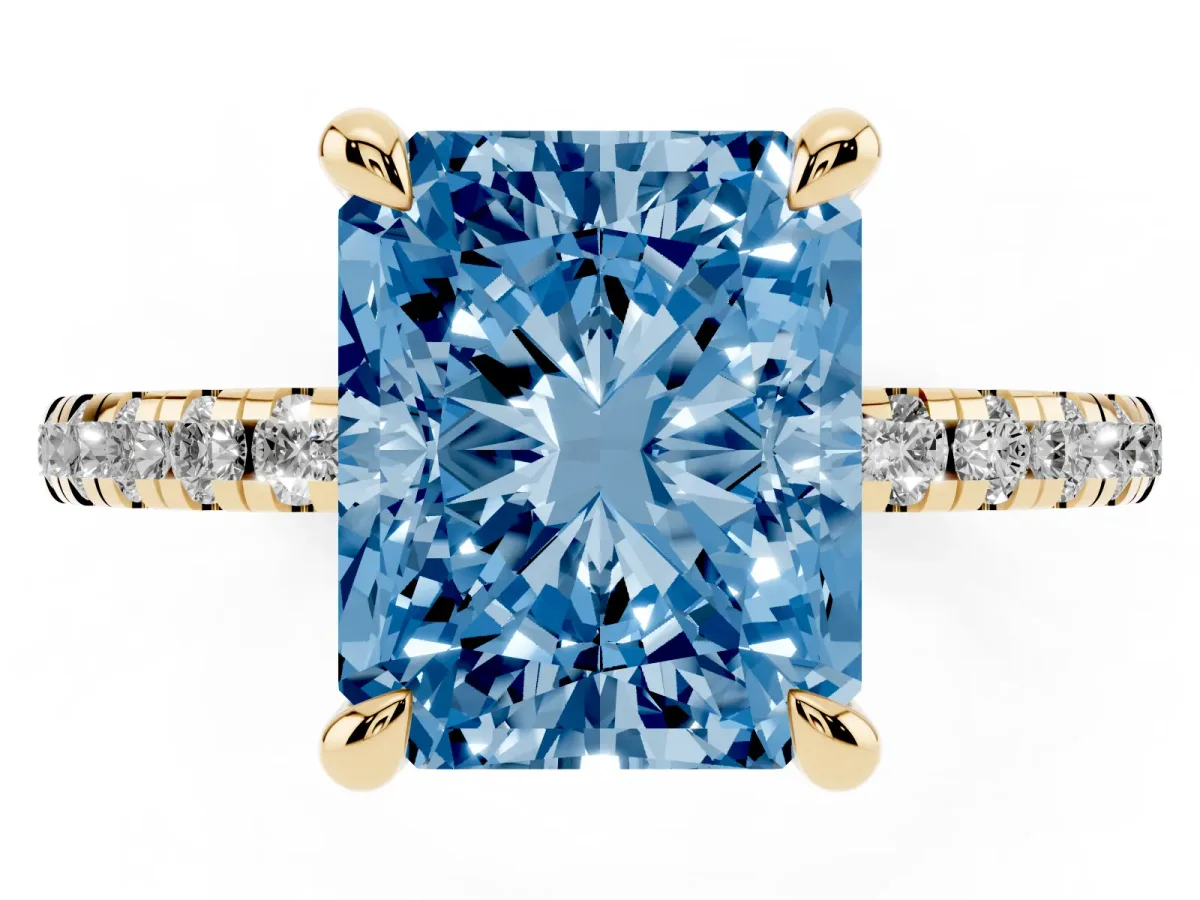 Fancy Blue Radiant Cut Diamond Brilliant Solitaire Ring with Pavé Band and Four-Prong Setting Yellow gold