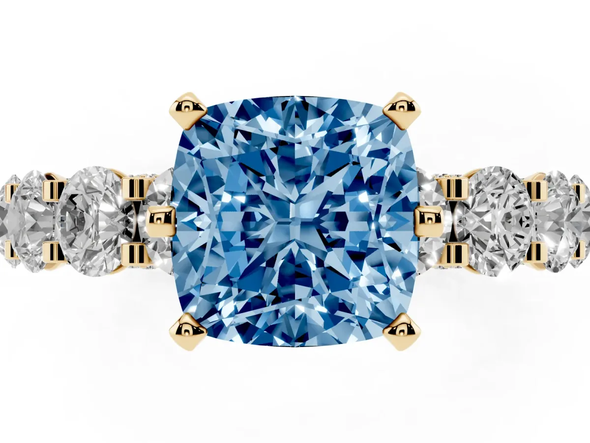 Fancy Blue Cushion Cut Diamond Side Stone Engagement Ring with Four-Prong Setting Yellow gold