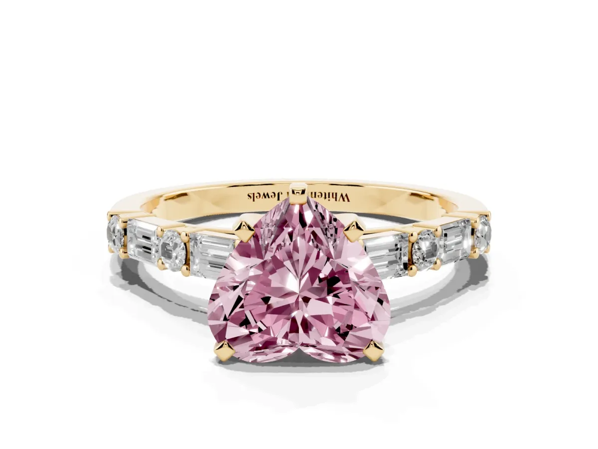 Fancy Pink Heart Cut Diamond Solitaire with Side Baguettes and Channel Set Band Yellow gold