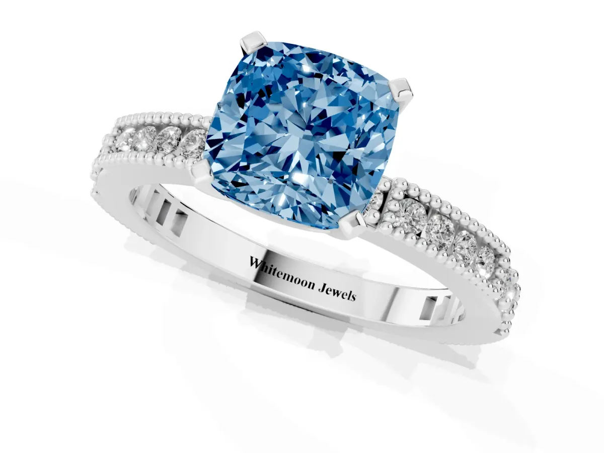 Fancy Blue Cushion Cut Solitaire with Pavé Band and Four-Prong Setting Silver