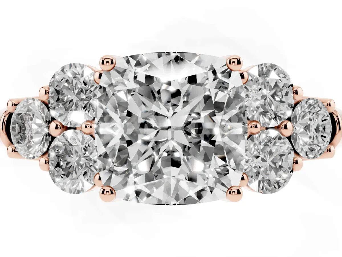 Cushion Cut Cut Diamond Cluster Ring with Round Accent Stones and Prong Setting on a Classic Band Rose gold