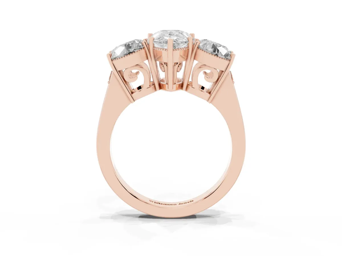 Three-Stone Pear Cut Diamond Engagement Ring with Prong Setting on a Classic Band Rose gold