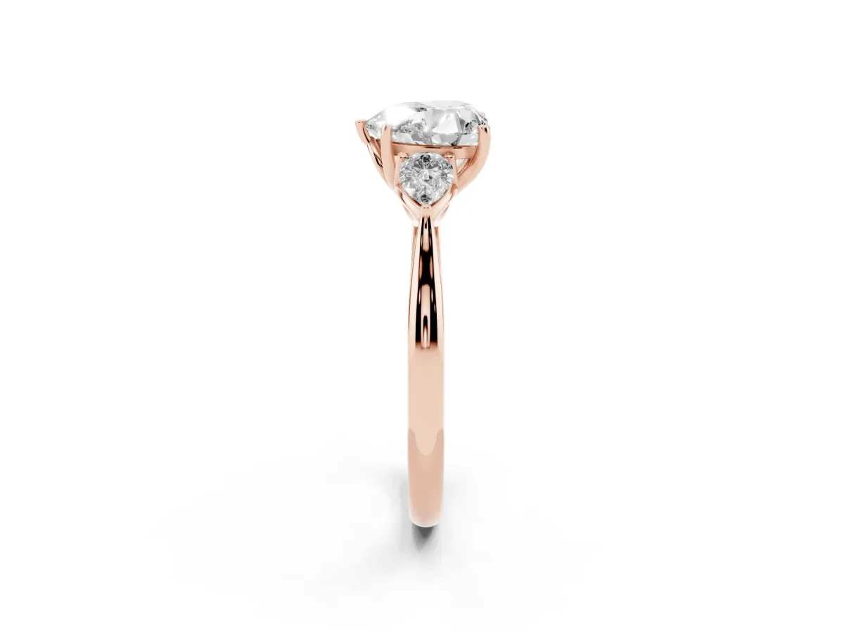Three-Stone Heart Cut Brilliant Diamond Solitaire Ring with Tapered Band and Four-Prong Setting Rose gold