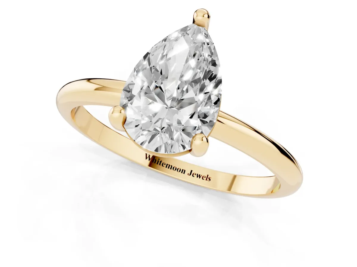 Pear Cut Solitaire Diamond Ring with 4-Prong Setting on a Classic Band Yellow gold