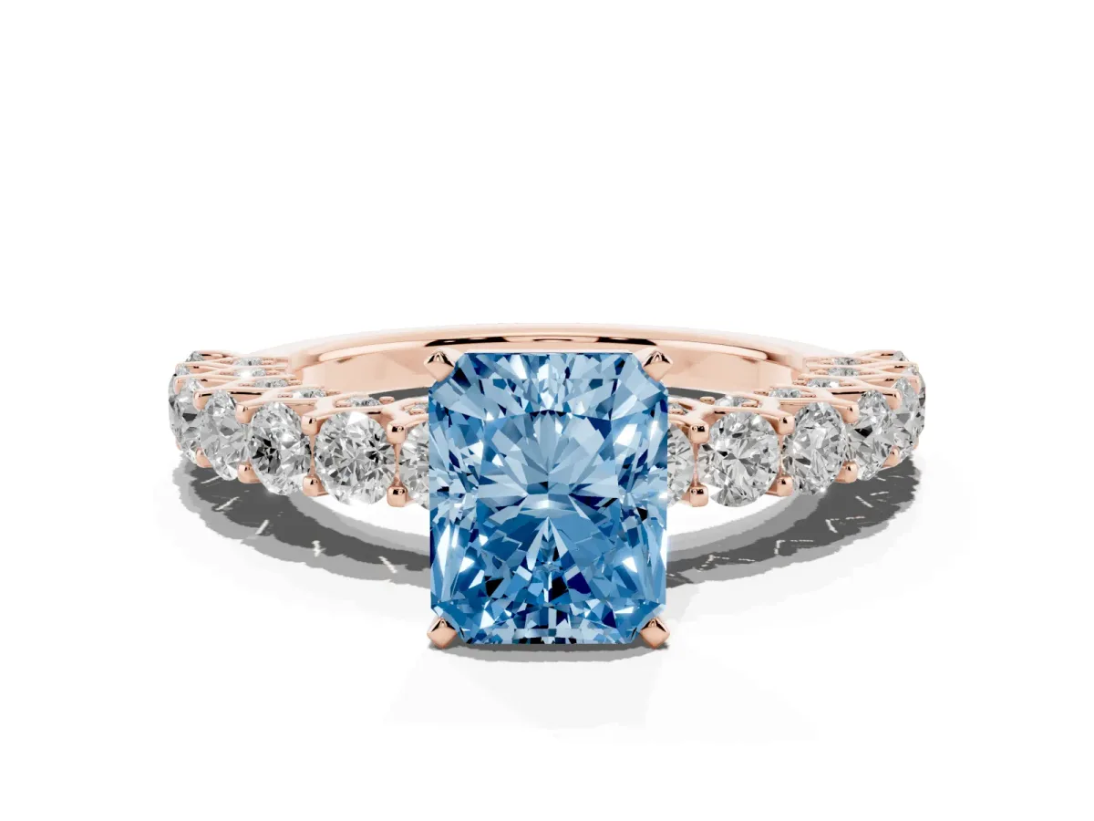 Fancy Blue Radiant Cut Diamond Solitaire Ring with Shared Prong Pavé Band and Four-Prong Setting Rose gold