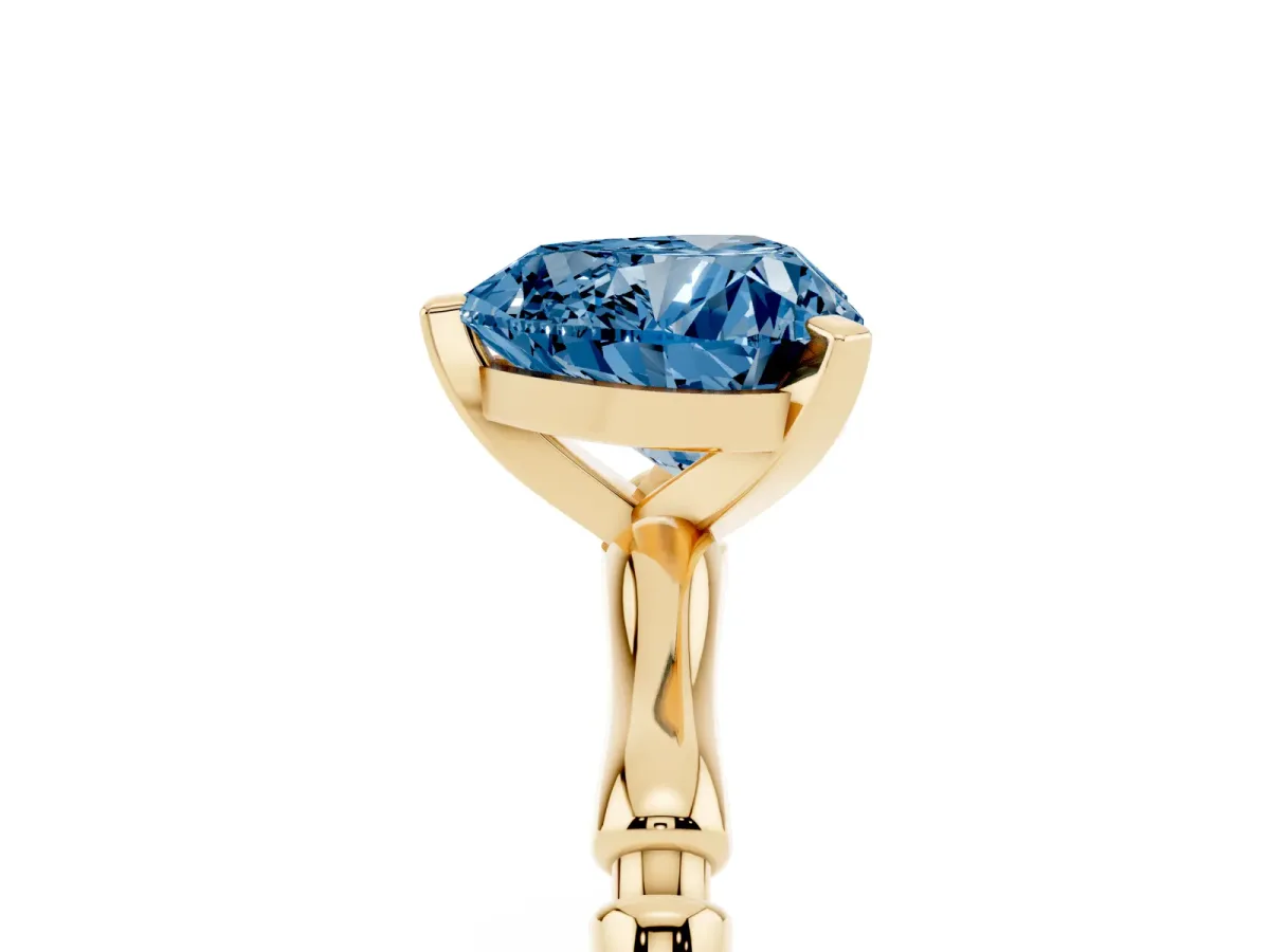 Fancy Blue Heart Cut Solitaire Diamond Ring with Bamboo Band and Four-Prong Setting Yellow gold