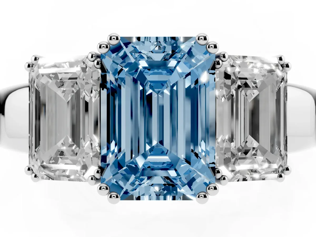 Fancy Blue Three-Stone Emerald Cut Cut Diamond Ring with Channel Set Band and Four-Prong Setting Silver