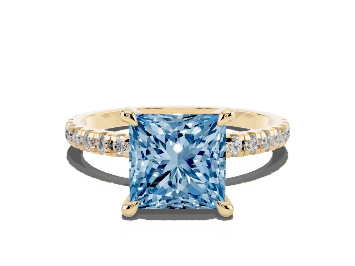 Fancy Blue Princess Cut Diamond Brilliant Solitaire Ring with Pavé Band and Four-Prong Setting Yellow gold