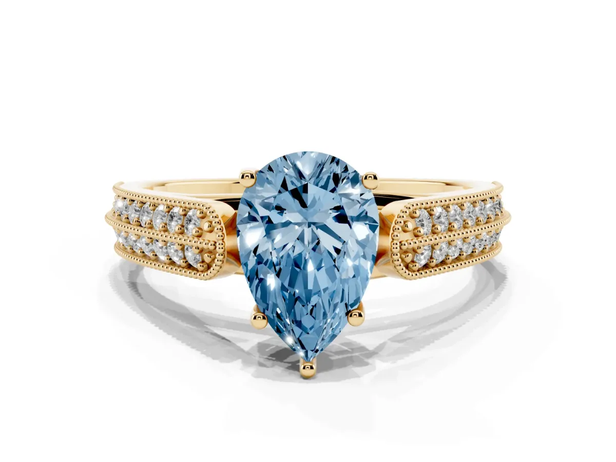 Fancy Blue Pear Cut Cut Pave Split Shank Engagement Ring with Four-Prong Setting Yellow gold