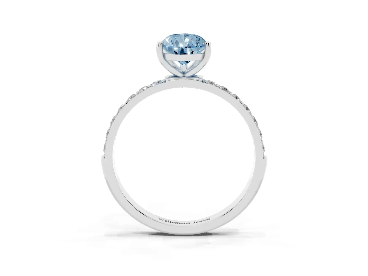 Fancy Blue Pear Cut Diamond Solitaire Ring with Round Pavé Shoulders and Prong Setting Silver