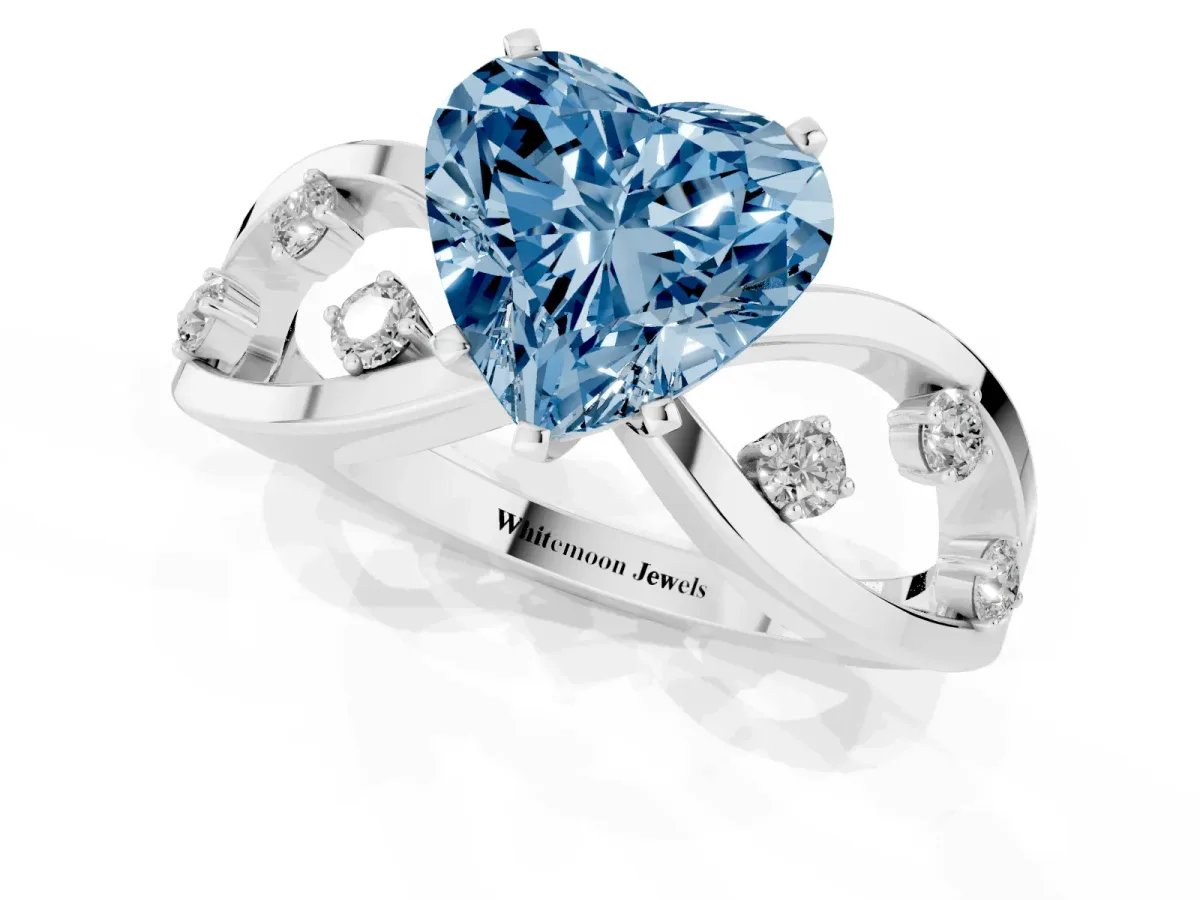 Fancy Blue Heart Cut Cut Solitaire Diamond with Side Stones on Criss-Cross Band and Four-Prong Setting Silver