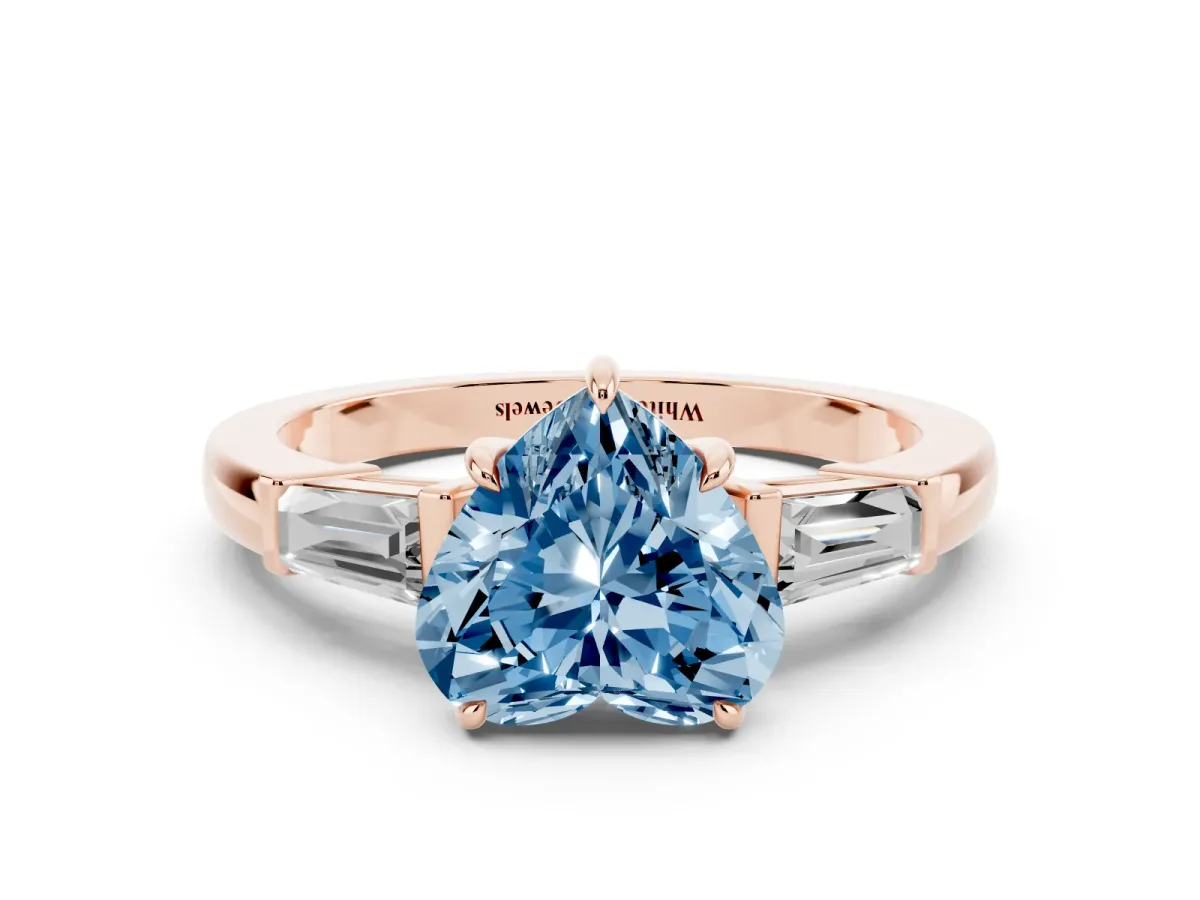Fancy Blue Heart Cut Diamond Three-Stone Ring with Tapered Baguette Side Stones and Prong Setting Rose gold
