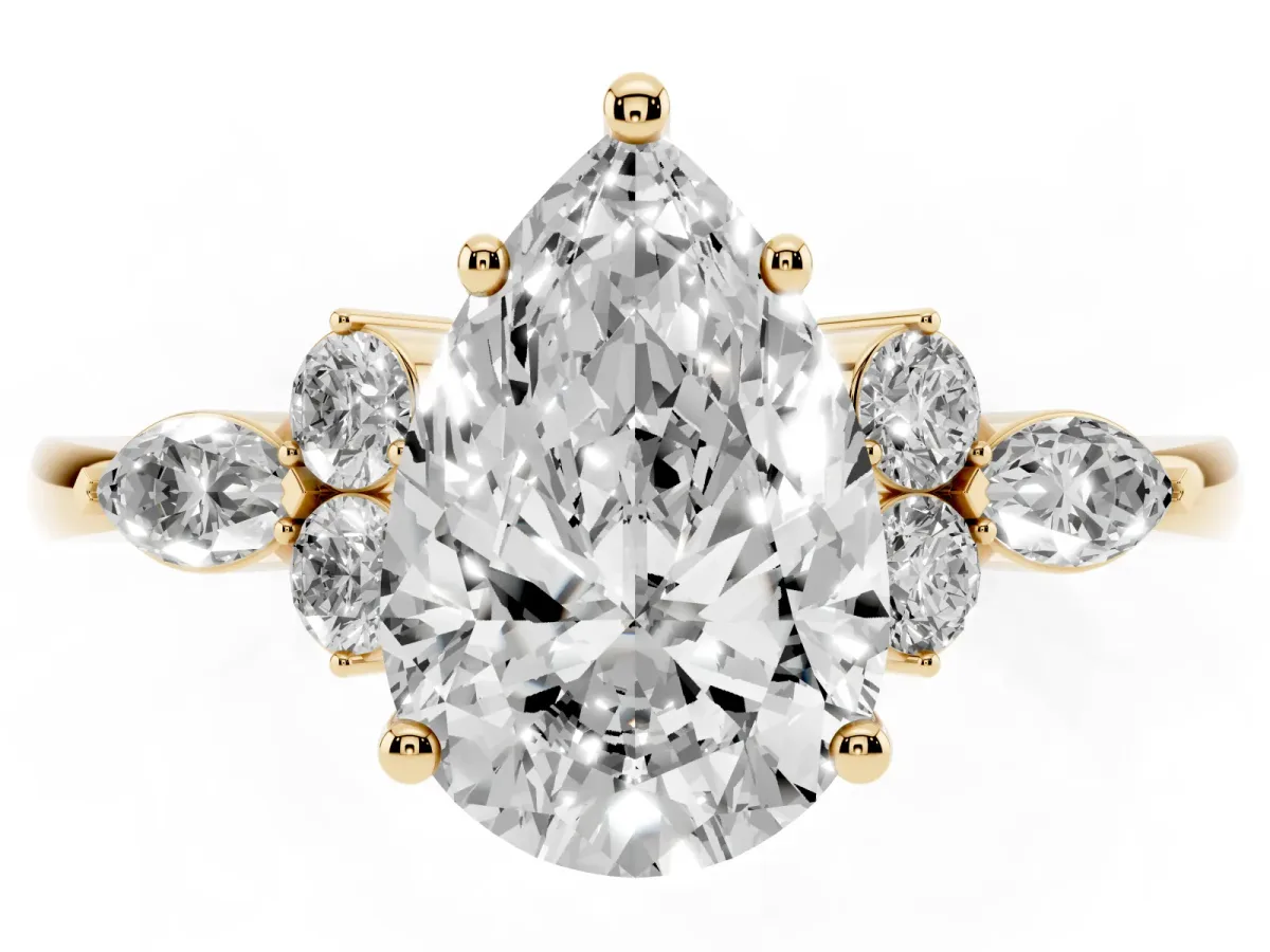 Pear Cut Brilliant Diamond Solitaire Ring with Pear Side Stones and Four-Prong Setting Yellow gold