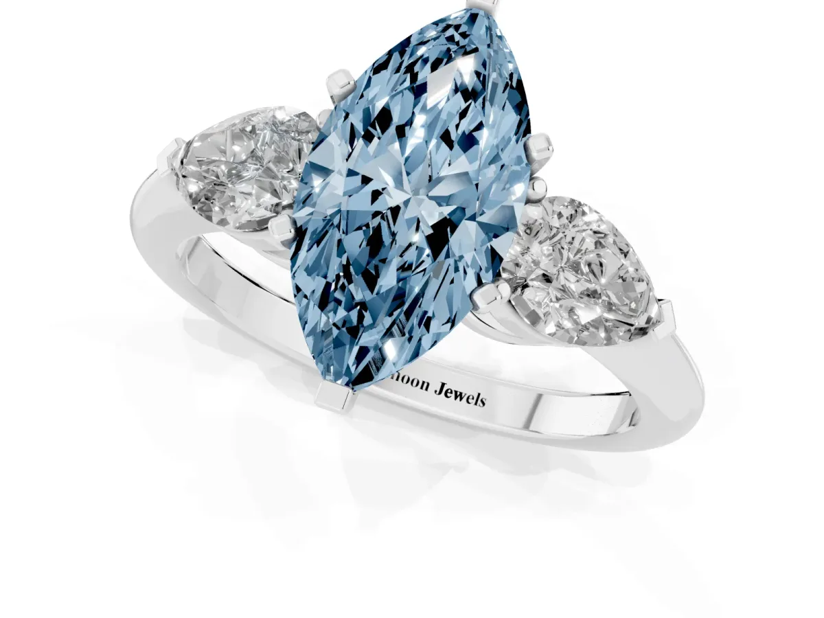 Fancy Blue Three-Stone Marquise Cut Diamond Ring with Pear Side Stones and Four-Prong Setting Silver
