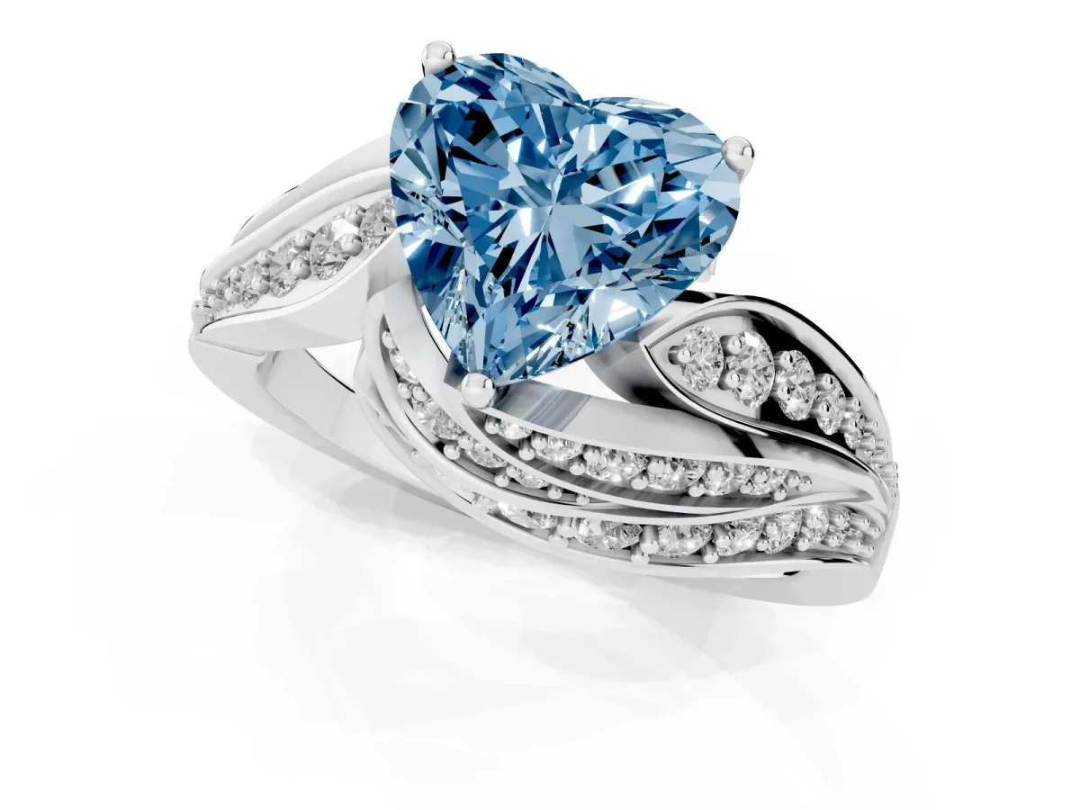 Fancy Blue Heart Cut Diamond Solitaire Ring with Prong Setting and Twisted Pavé Band Silver