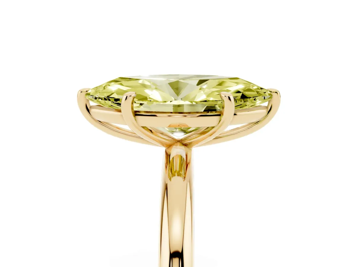 Fancy Yellow Oval Cut Solitaire Diamond Ring with Four-Prong Setting on a Plain Band Yellow gold