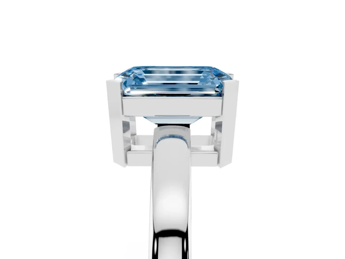 Fancy Blue Emerald Cut Cut Solitaire Ring with Four-Prong Setting and Classic Band Silver