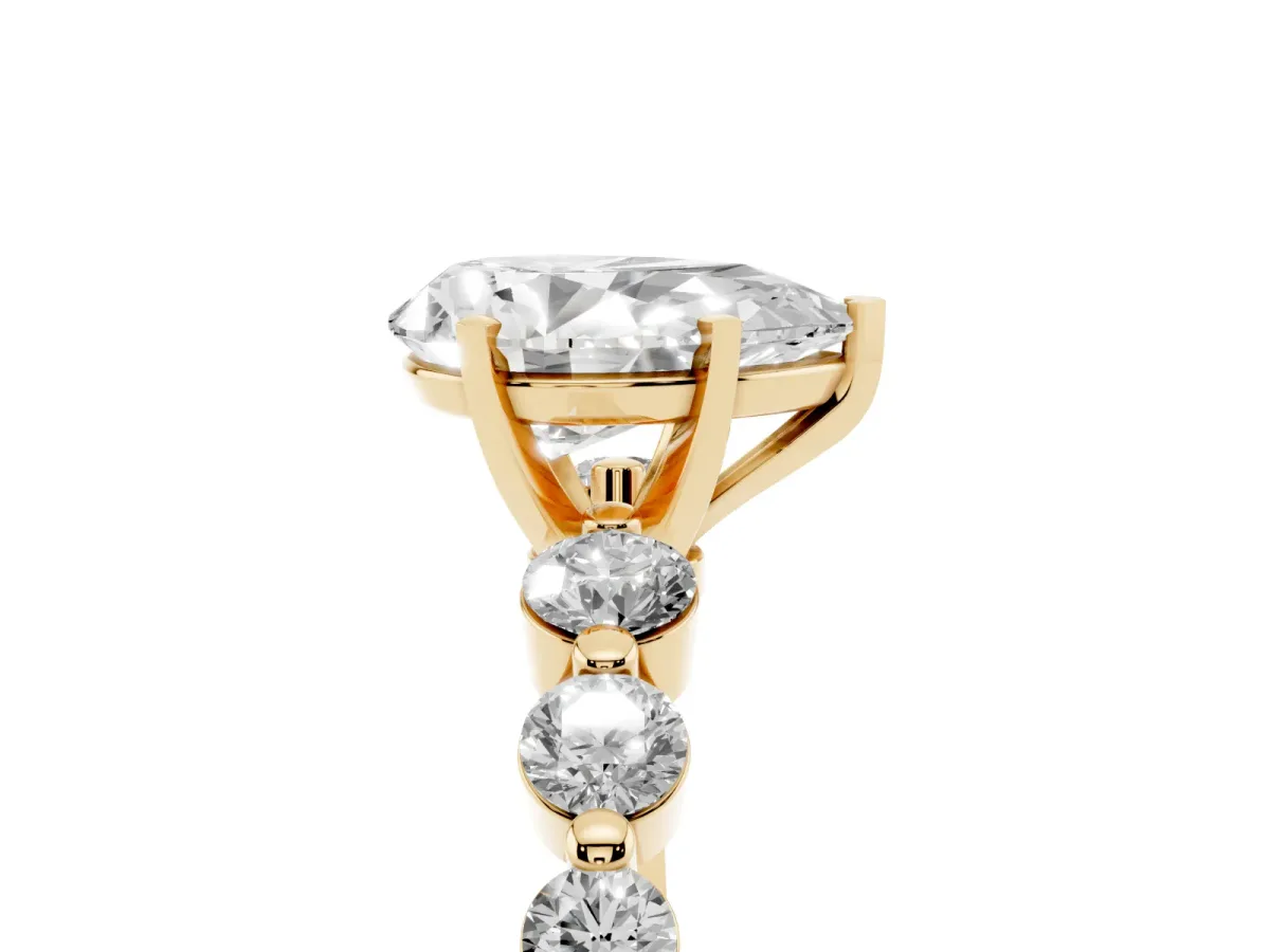 Pear Cut Solitaire Diamond Ring with Pave Band and Four-Prong Setting Yellow gold