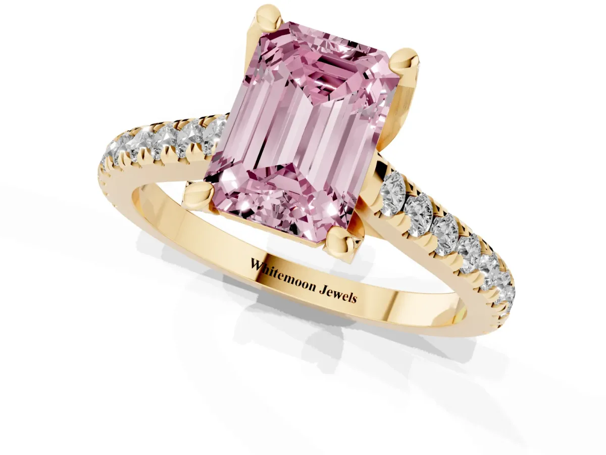 Fancy Pink Emerald Cut Brilliant Diamond Solitaire with Pavé Band and Four-Prong Setting Yellow gold