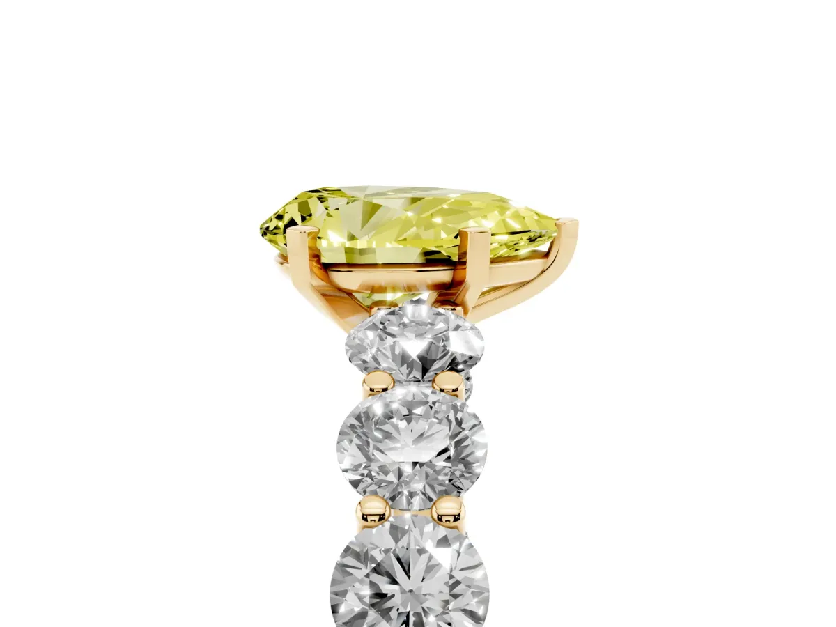 Fancy Yellow Pear Cut Diamond Prong Setting with Side Stones on a Pave Band Yellow gold