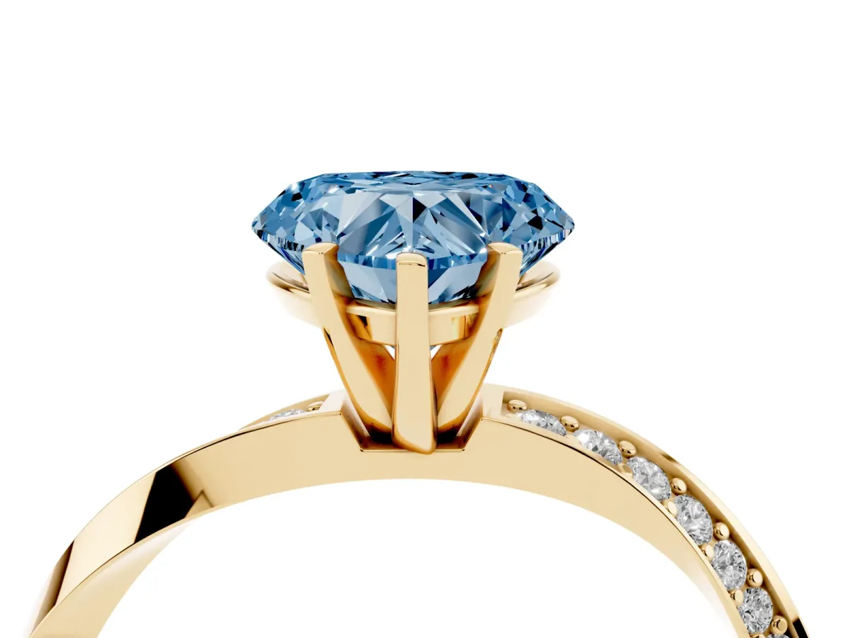 Fancy Blue Heart Cut Diamond Engagement Ring with Side Stone Accents and Four-Prong Setting Yellow gold