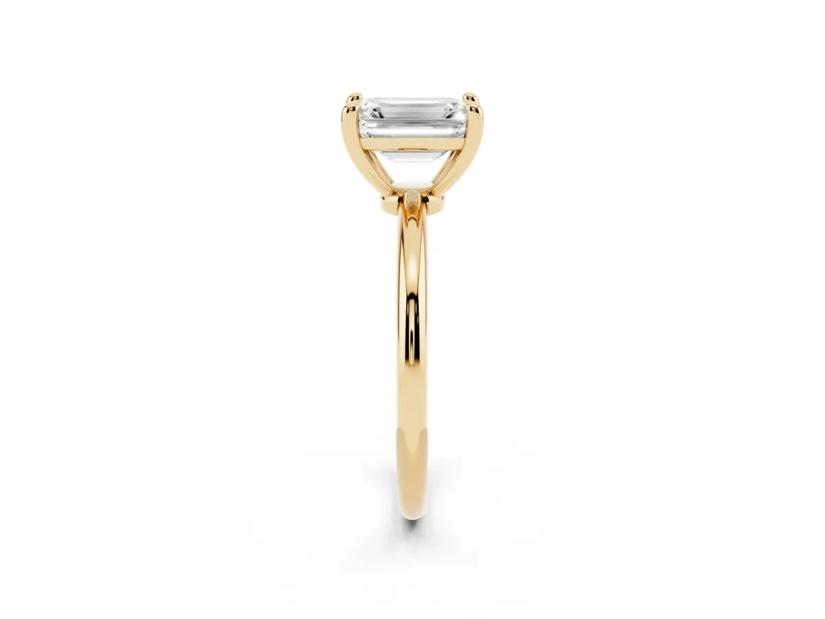 Emerald Cut Solitaire Diamond Ring with 4-Prong Setting on a Classic Band Yellow gold