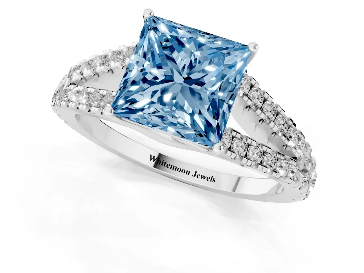 Fancy Blue Princess Cut Diamond Split Shank Pavé Engagement Ring with Four-Prong Setting White gold