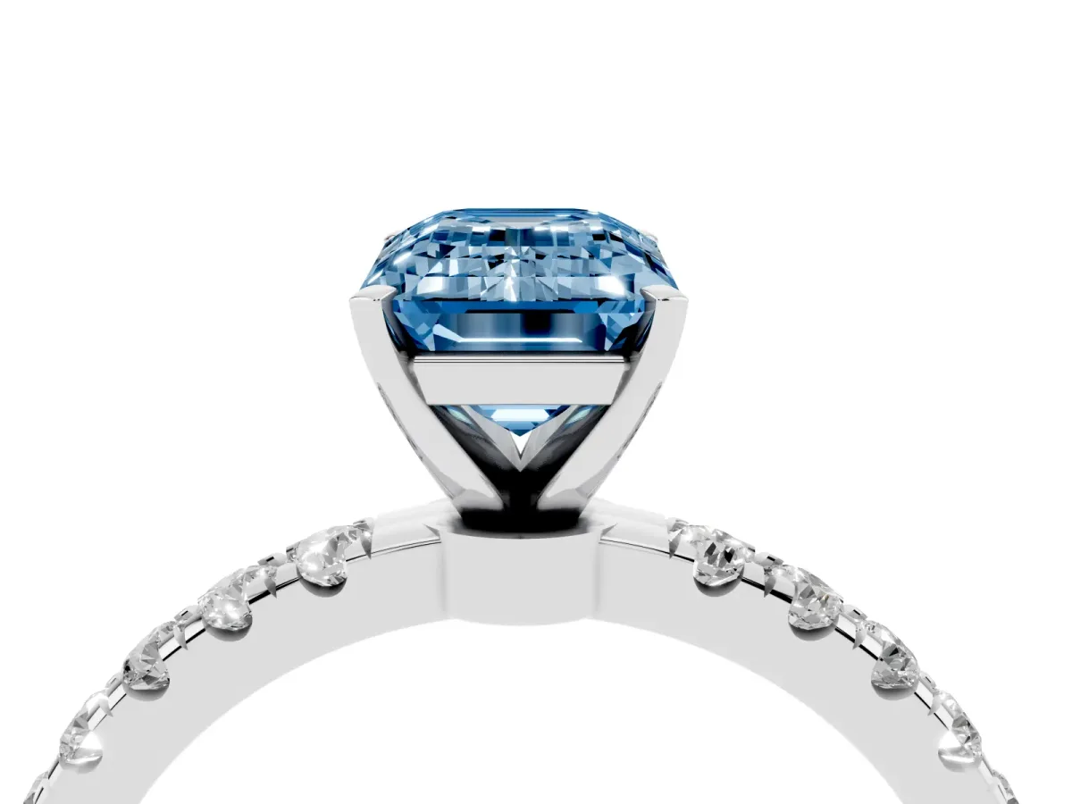 Fancy Blue Emerald Cut Diamond Solitaire Ring with Pavé Accents and Four-Prong Setting Platinum