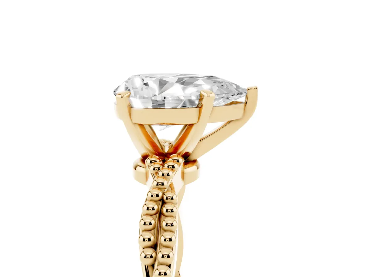 Pear Cut Solitaire Twisted Band with Bead Prong Setting Yellow gold