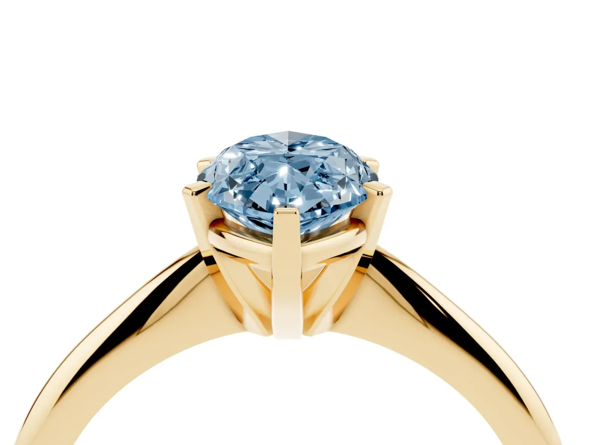 Fancy Blue Marquise Cut Cut Solitaire Ring with Four-Prong Setting on a Classic Band Yellow gold