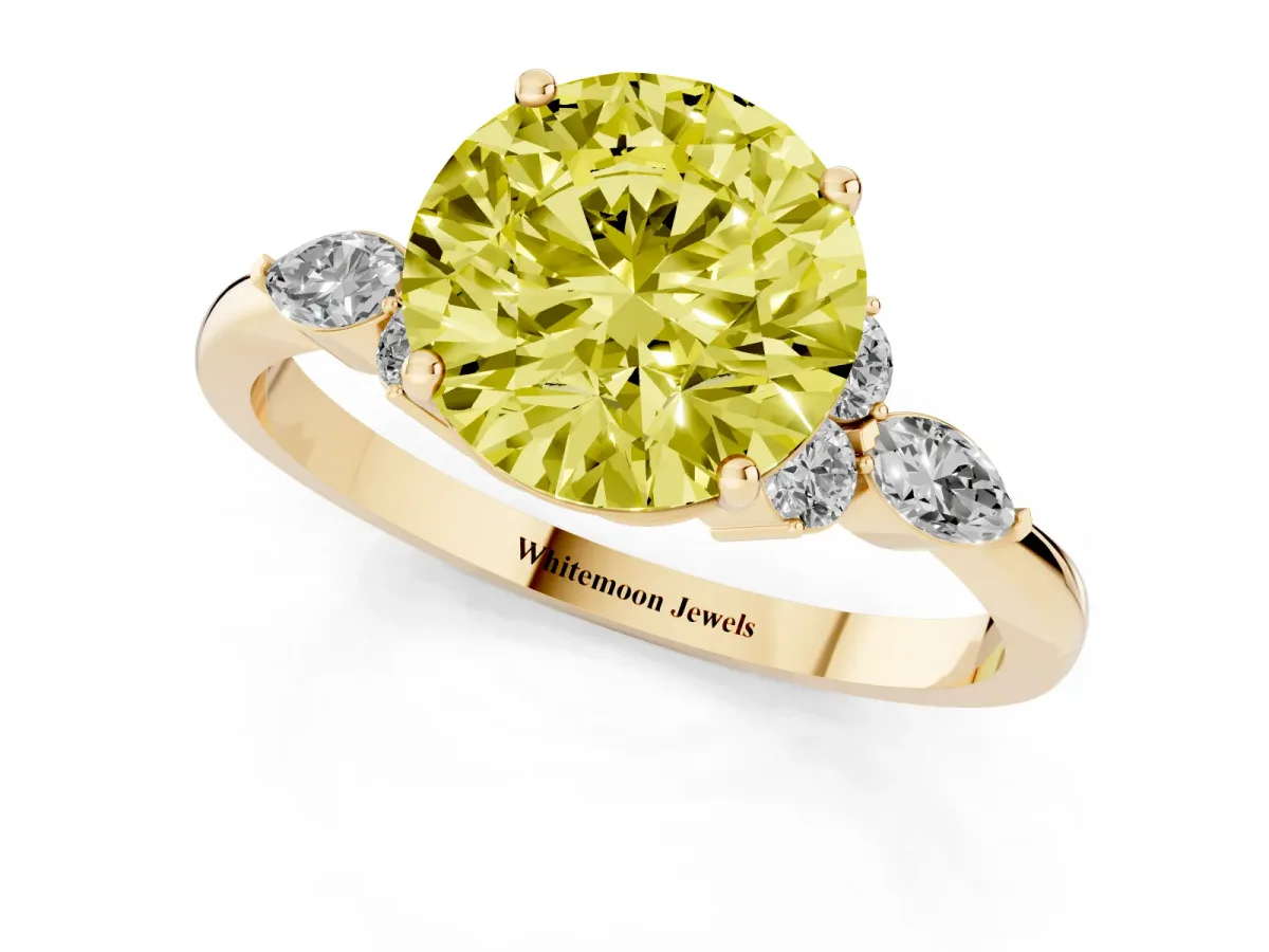 Fancy Yellow Round Cut Brilliant Diamond Solitaire Ring with Pear Side Stones and Four-Prong Setting Yellow gold