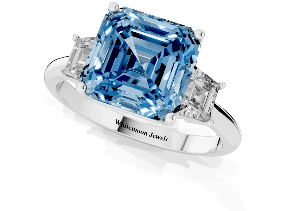 Fancy Blue Asscher Cut Diamond Three-Stone Ring with Trapezoid Side Stones and Prong Setting Platinum