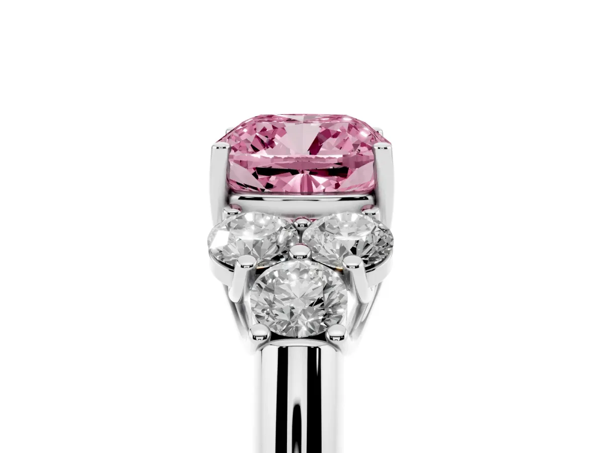 Fancy Pink Cushion Cut Cut Diamond Cluster Ring with Round Accent Stones and Prong Setting on a Classic Band Platinum
