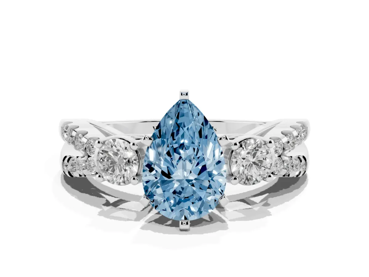 Fancy Blue Pear Cut Diamond Three-Stone Ring with Pavé Split Shank and Four-Prong Setting Silver
