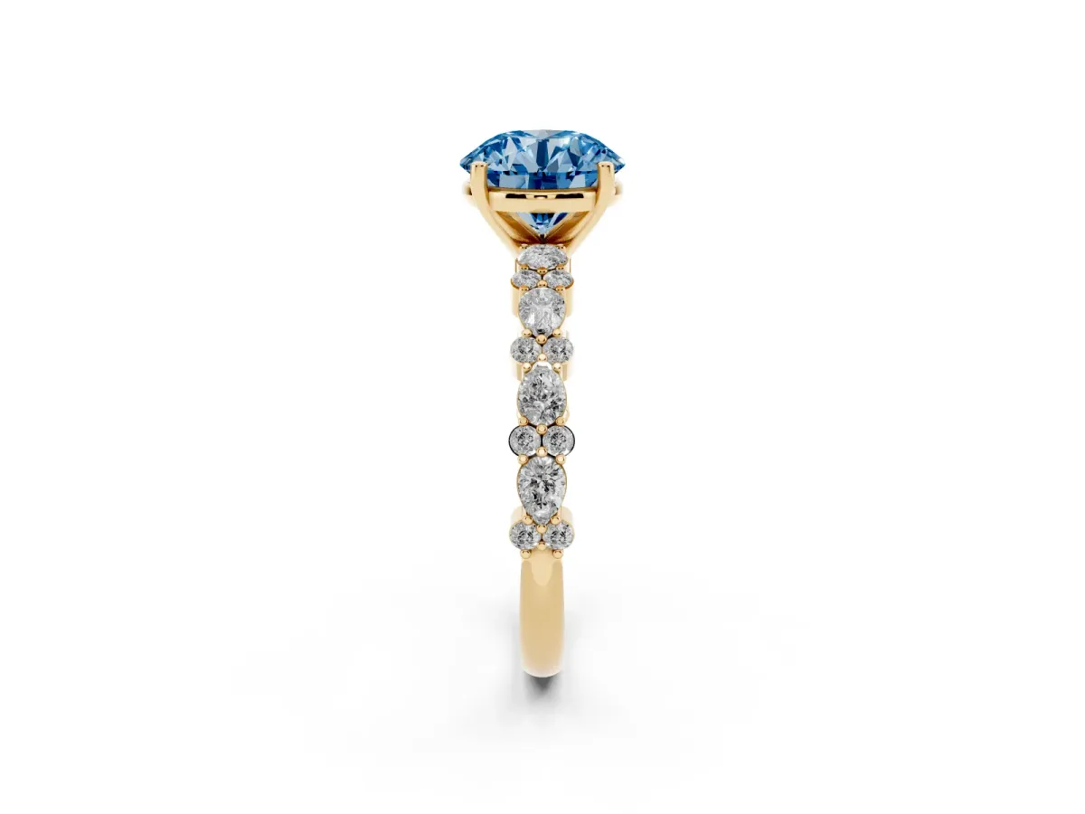 Fancy Blue Round Cut Diamond Side Stone Solitaire Ring with Round and Four-Prong Setting Yellow gold