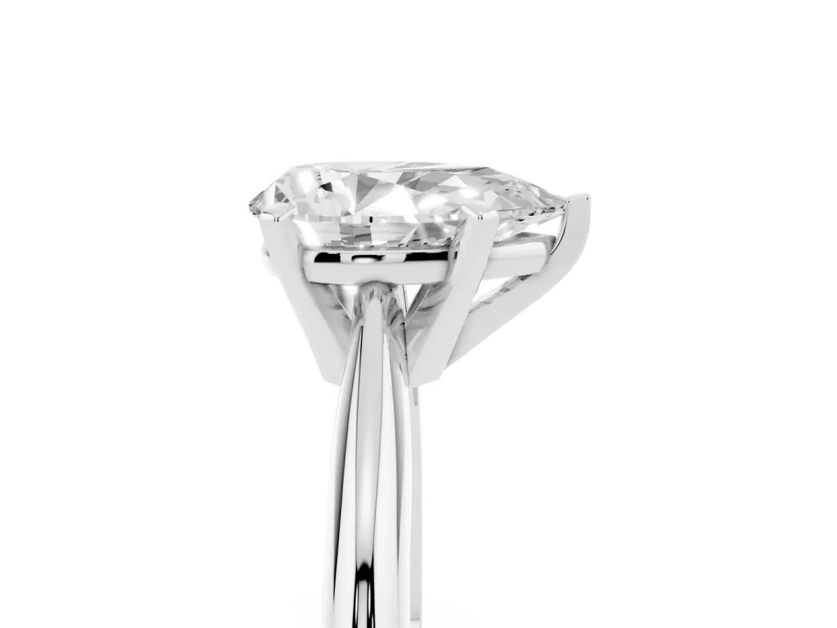 Pear Cut Cut Solitaire Ring with Four-Prong Setting on a Classic Band Silver