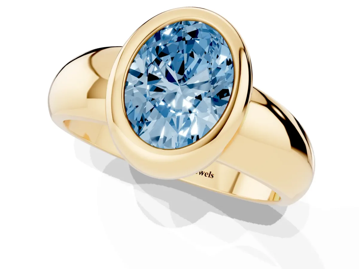 Fancy Blue Bezel Set Oval Cut Solitaire Ring with Wide Band Yellow gold