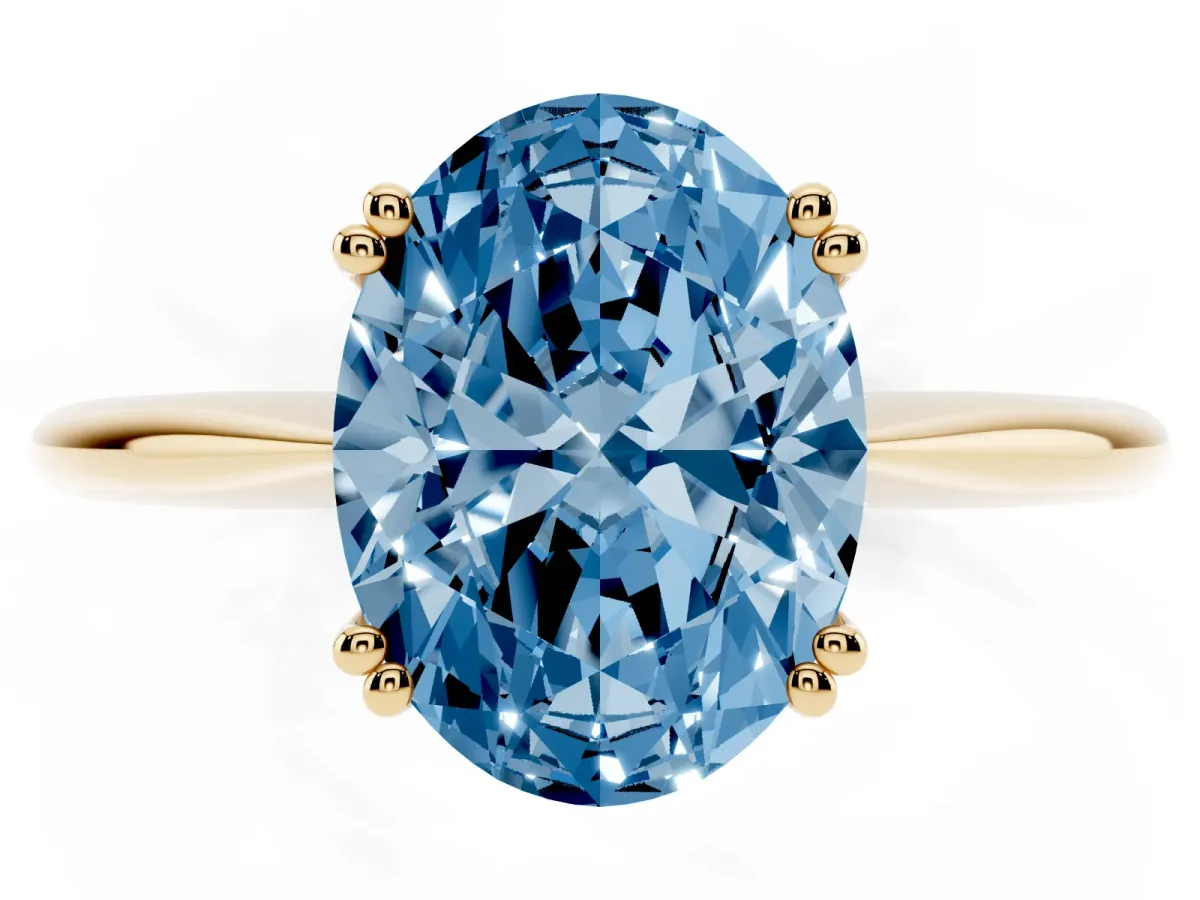 Fancy Blue Oval Cut Solitaire Diamond Ring with Six-Prong Setting and Classic Band Yellow gold
