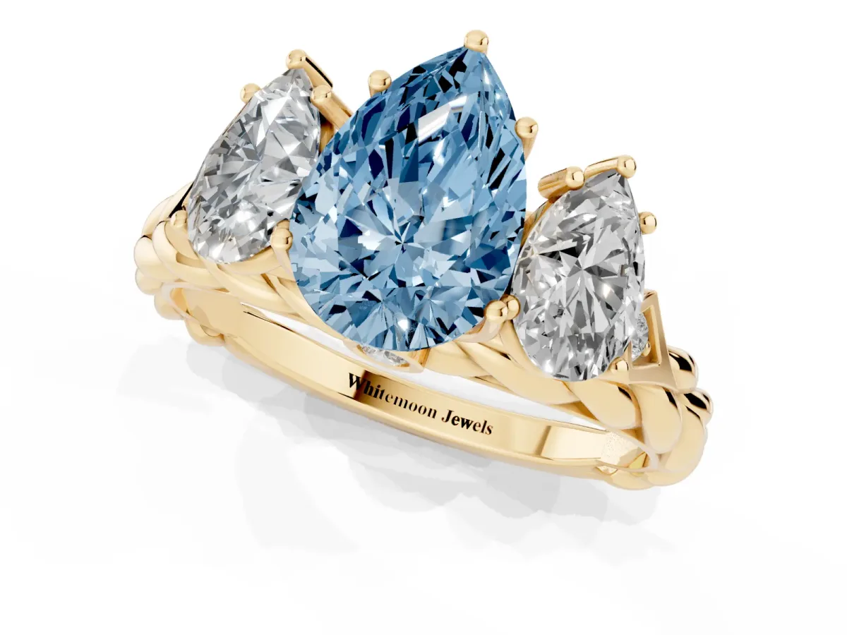 Fancy Blue Three-Stone Pear Cut Diamond Braided Band Ring with Four-Prong Setting Yellow gold