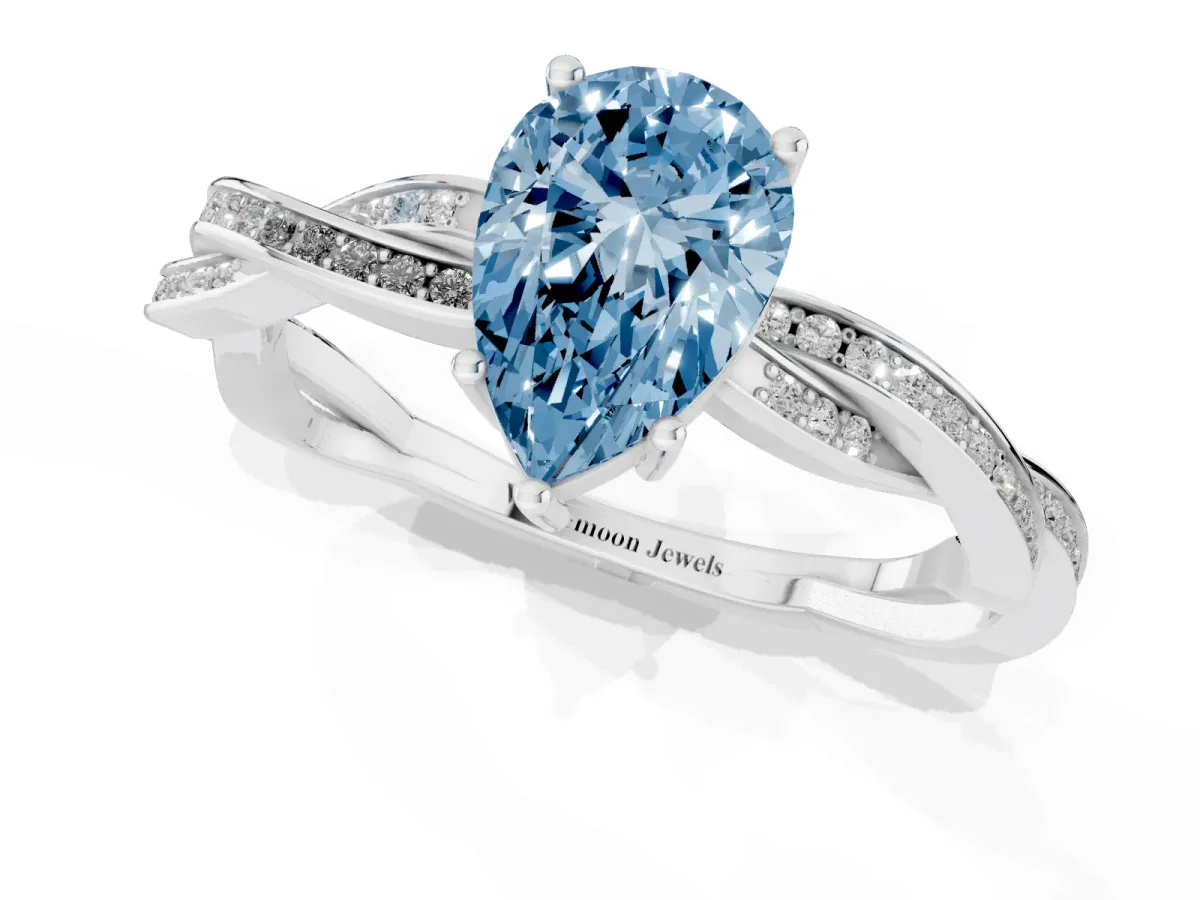Fancy Blue Pear Cut Solitaire Twisted Pave Diamond Ring with Four-Prong Setting Silver