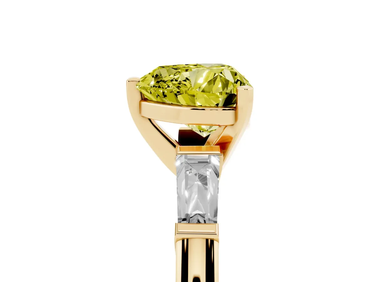 Fancy Yellow Heart Cut Solitaire with Tapered Baguette Side Stones on a Classic Band with Four-Prong Setting Yellow gold