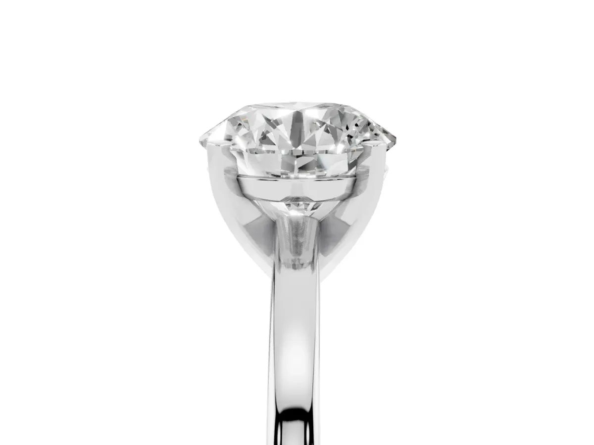 Round Cut Solitaire Diamond Engagement Ring with Four-Prong Setting on a Classic Band Silver