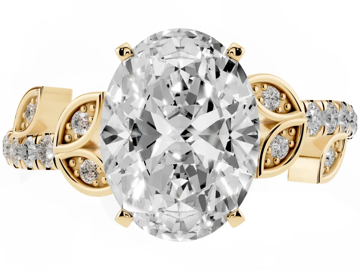 Oval Cut Solitaire Leaf-Inspired Diamond Ring with Pavé Band and Four-Prong Setting Yellow gold