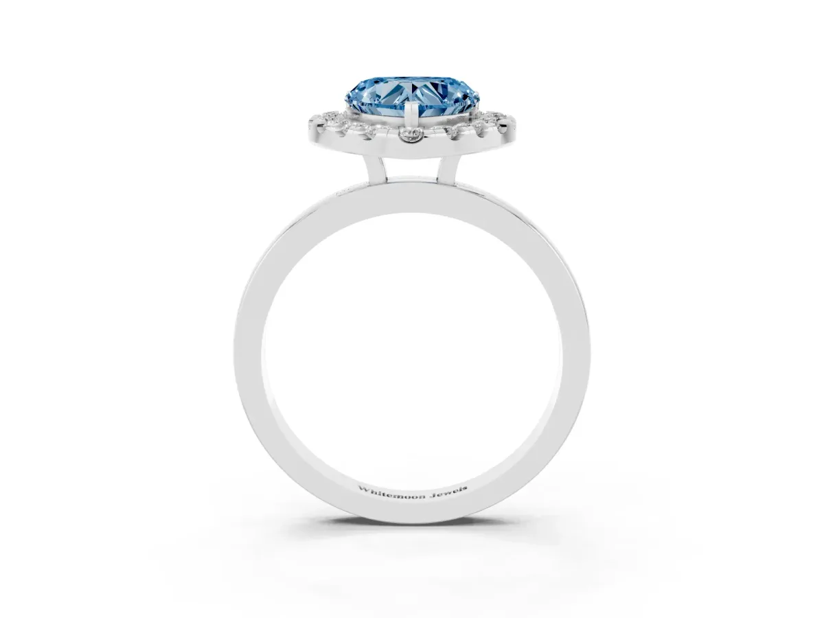 Fancy Blue Heart Cut Halo Diamond Solitaire with Pavé Band and Four-Prong Setting White gold