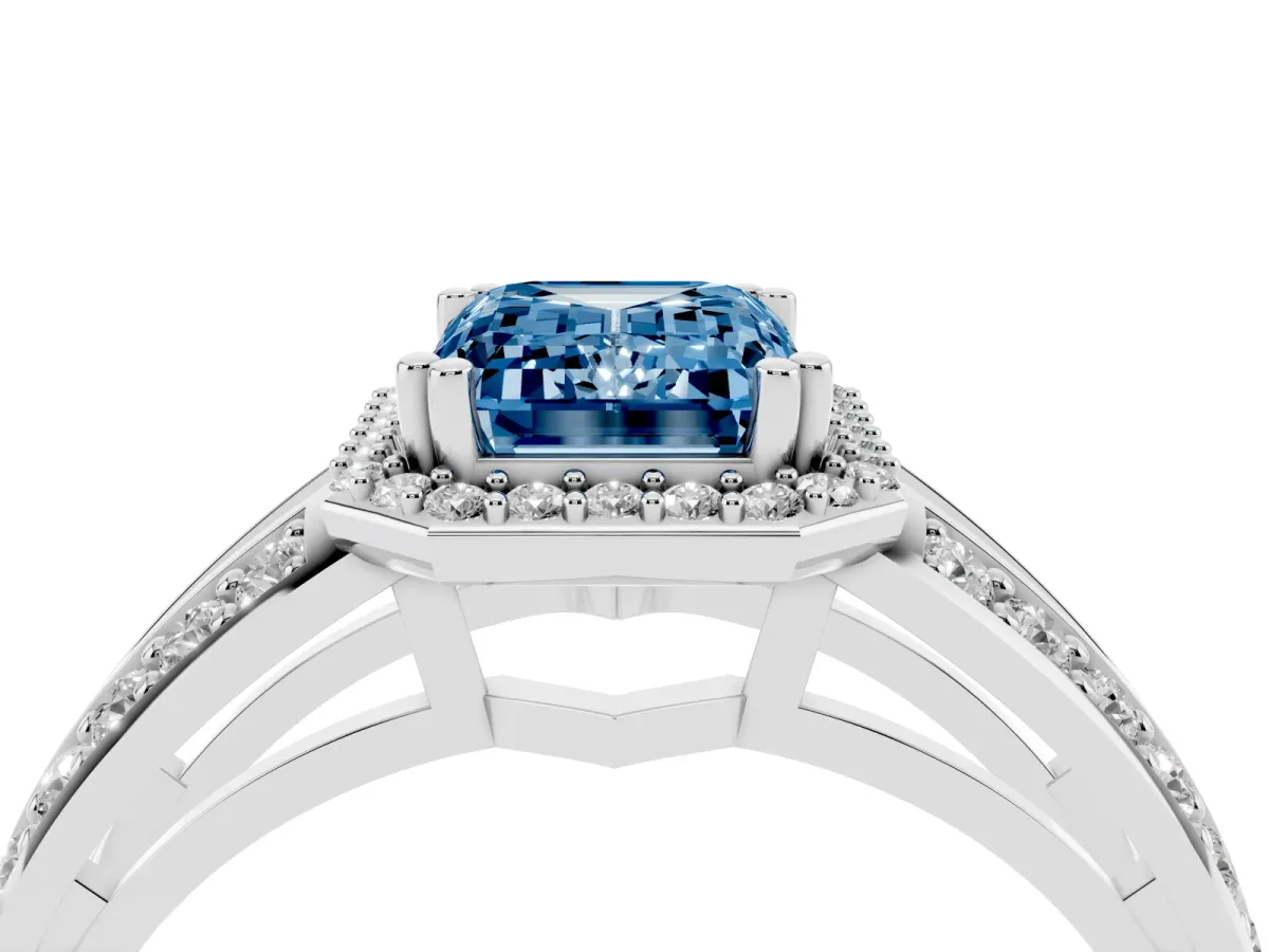 Fancy Blue Emerald Cut Diamond Halo Ring with Split Shank Pavé Band and Four-Prong Setting White gold