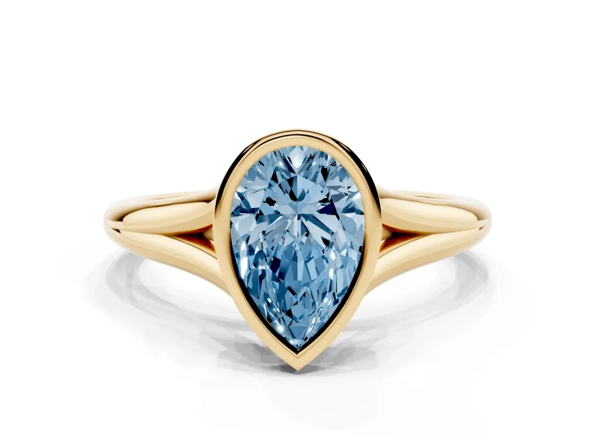Fancy Blue Bezel Set Pear Cut Cut Solitaire Ring with Tapered Band Yellow gold