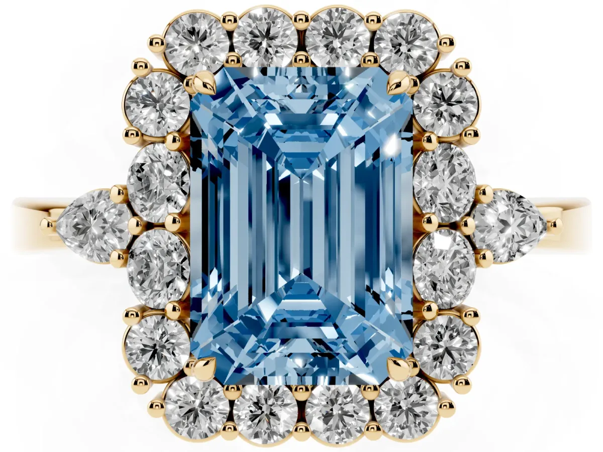 Fancy Blue Emerald Cut Diamond Halo Ring with Pear Side Stones and Prong Setting Yellow gold