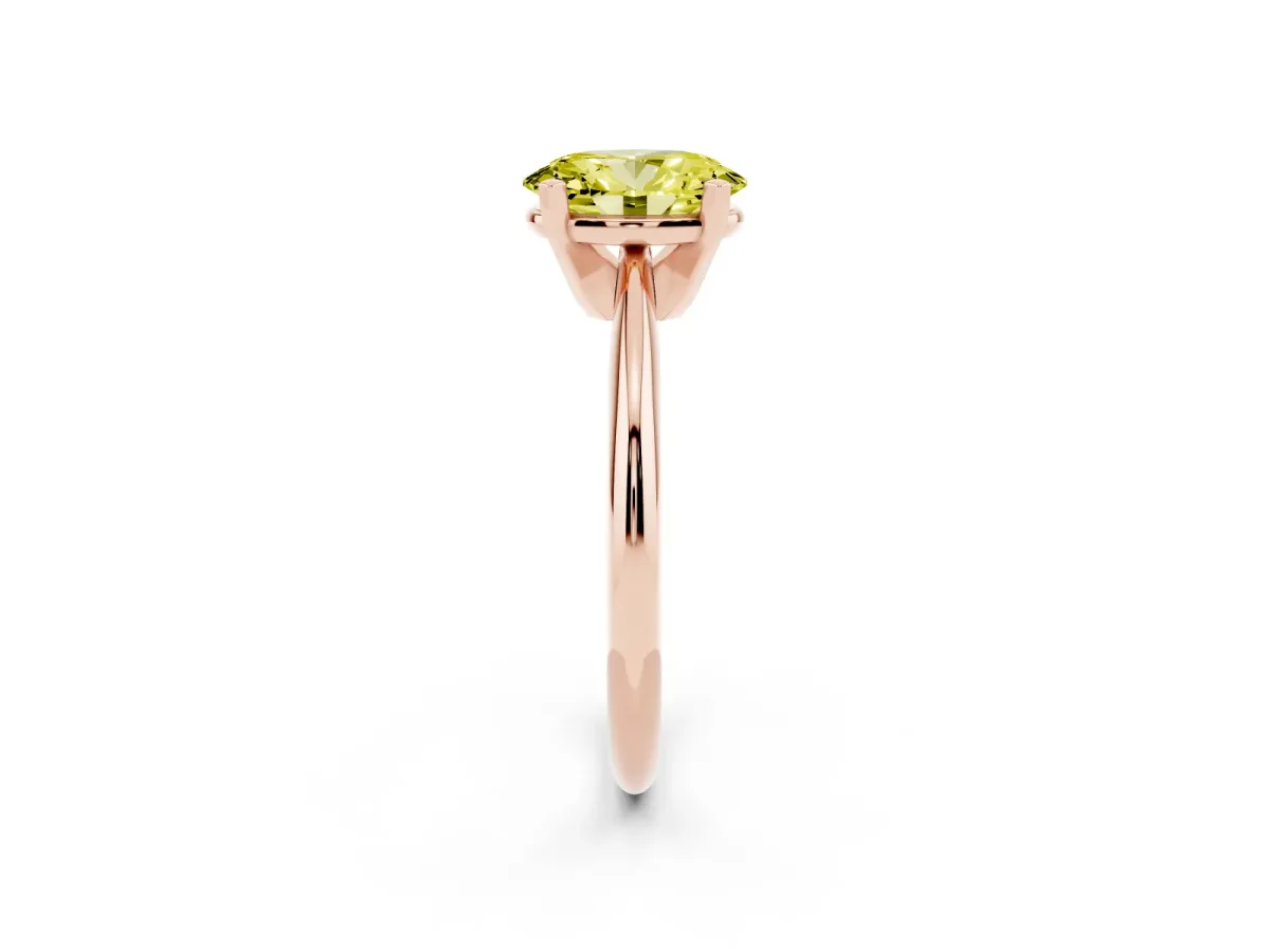 Fancy Yellow Oval Cut Cut Solitaire Ring with Four-Prong Setting on a Classic Band Rose gold