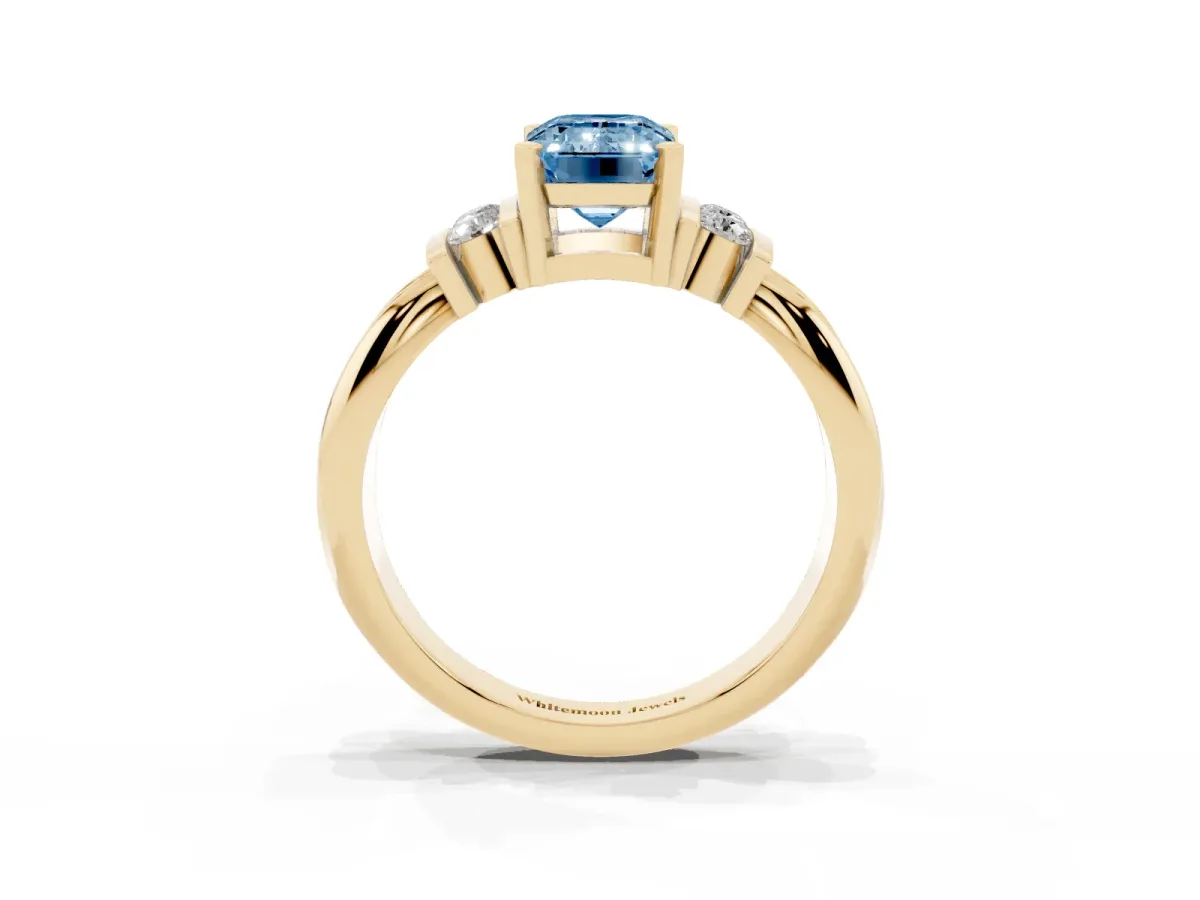 Fancy Blue Emerald Cut Cut Three-Stone Channel Set Ring with Bar Prongs Yellow gold