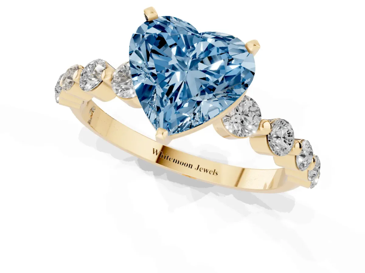 Fancy Blue Heart Cut Solitaire Diamond Ring with Pave Band and Four-Prong Setting Yellow gold